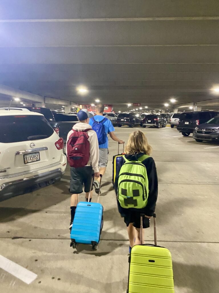Boys with carry-ons and backpacks starts the Epic Family Road Trip