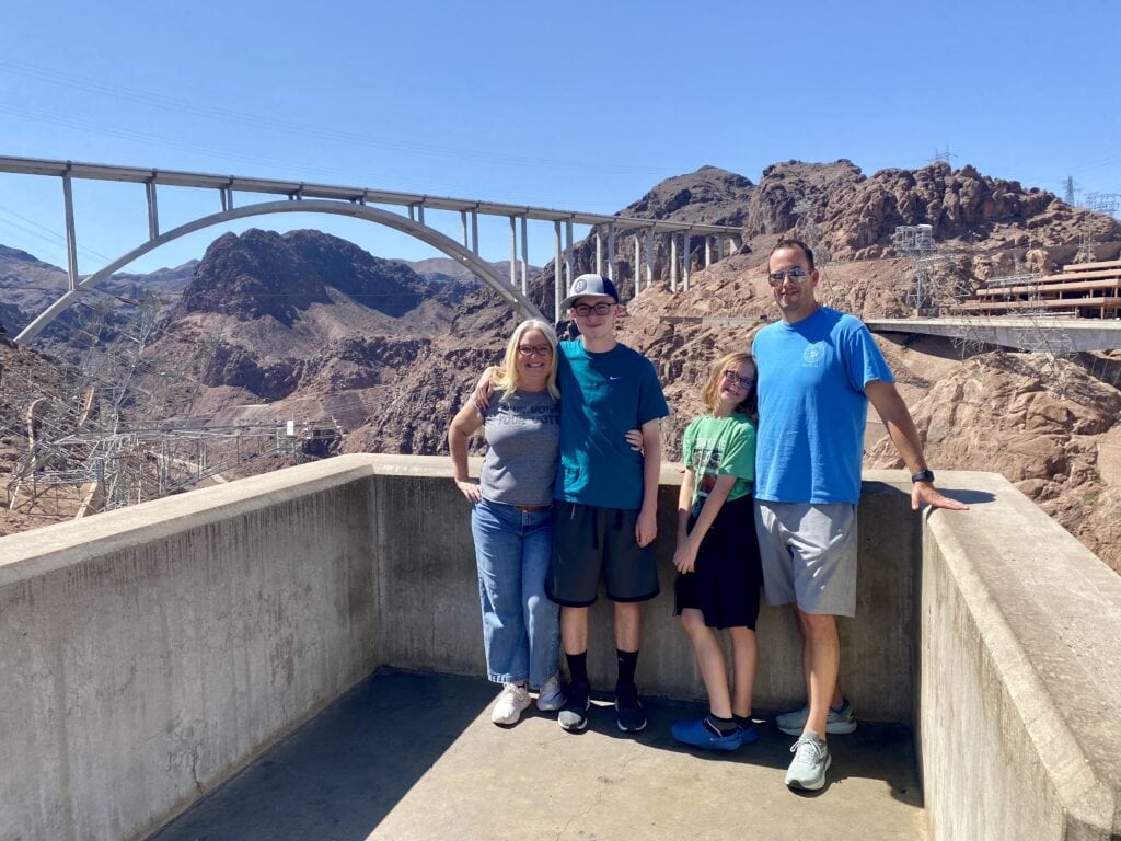 Family photo at Hoover Dam on Epic Family Road Trip