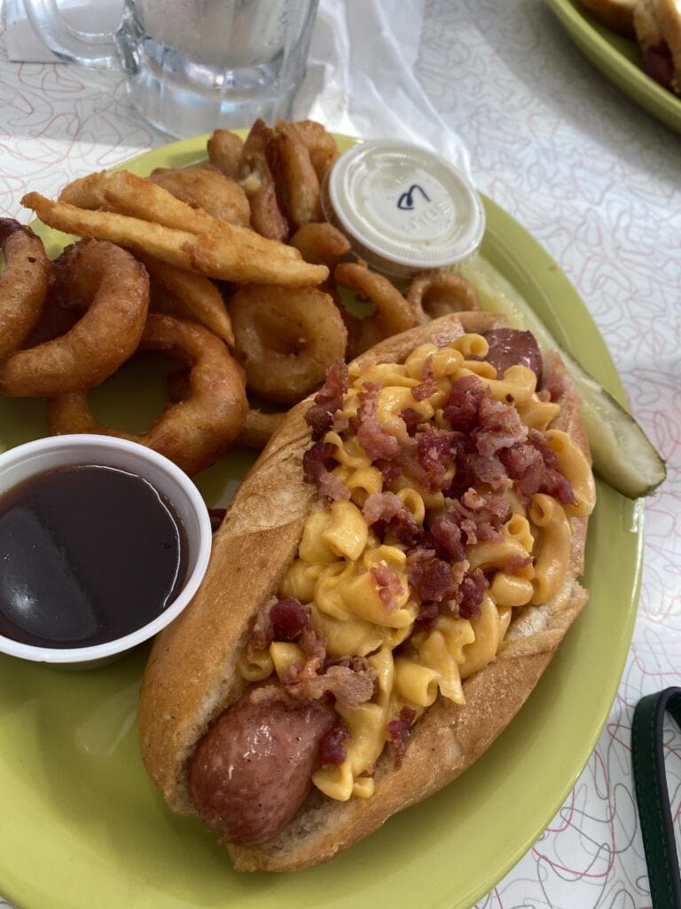 Mr. D'z Route 66 Diner Mac Dog - 1/4 pound all beef hot dog smothered with Mac & Cheese and Bacon