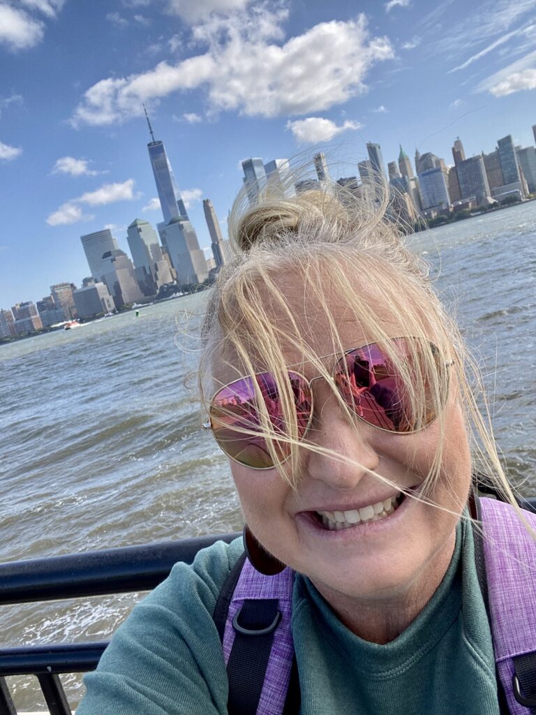 The blogger with the New York City skyline behind her.